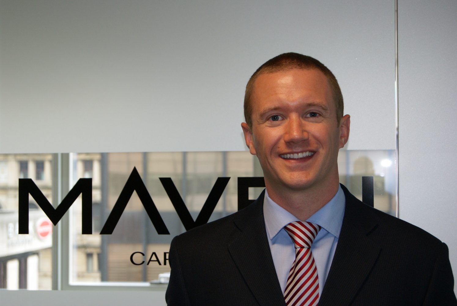 A headshot of Ryan Bevington, the Investment Director at Maven