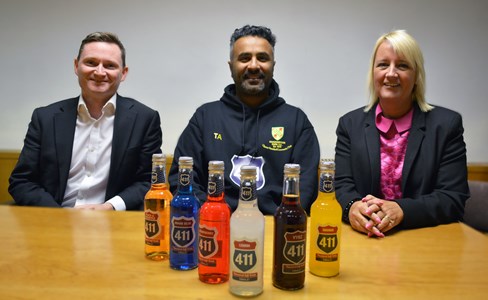 Mark Gibbons (GC Business Finance), Tasadduq Ashraf (Freez Global) and Sue Barnard (BBB) sitting at a table displaying some of Freez Global's products