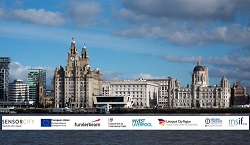 A view of the city of Liverpool with business logos along the bottom