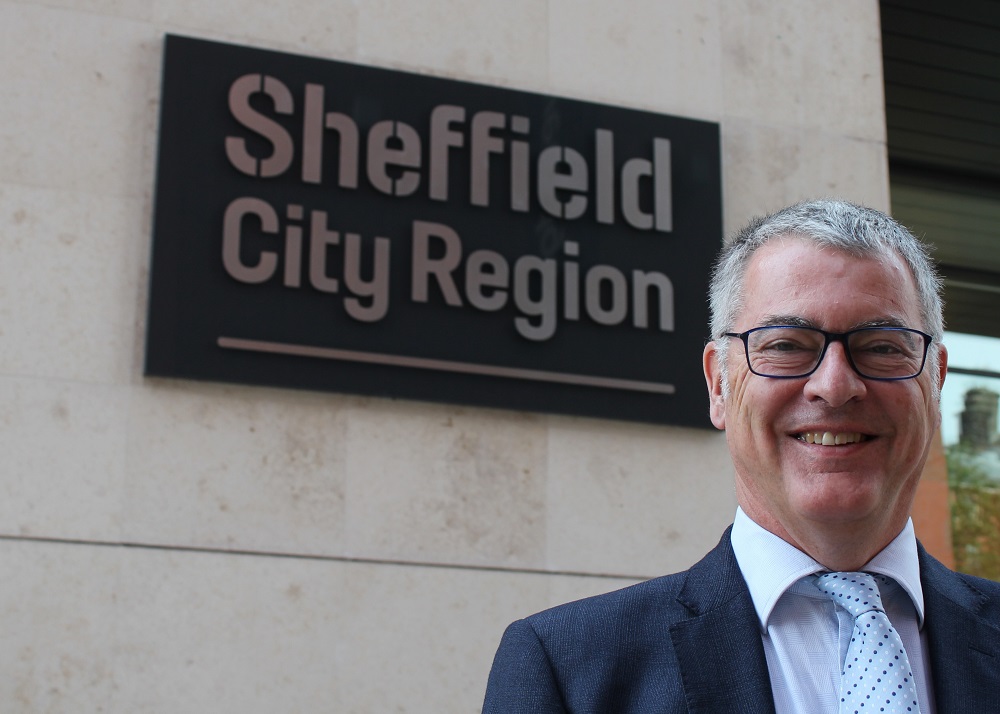 Neil MacDonald, NPIF Strategic Oversight Board Member stood outside a building with a Sheffield City Region sign