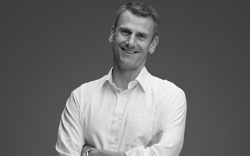 A headshot of Ben Hookway, CEO at Relative Insight smiling with his arms crossed